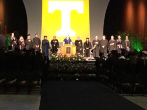 faculty on stage for commencement