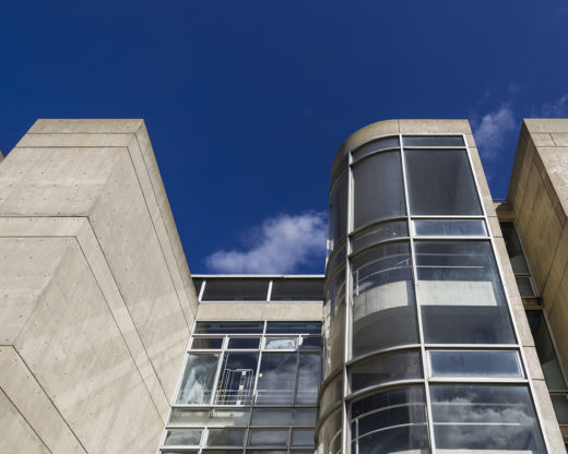 A detail shot of the exterior of the Art + Architecture building showing the windows