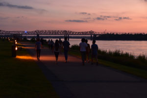 walking along the river at sunset