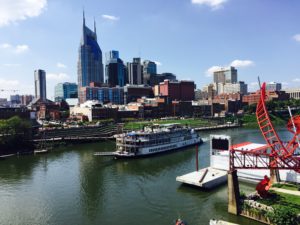 Looking across the river at downtown Nashville, TN, with a riverboat in the foreground.