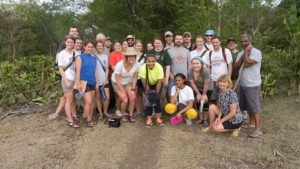 A group photo of 26 students and faculty members in Haiti.