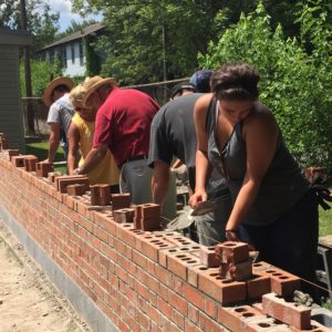 students building using bricks