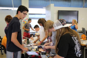 High school students work on creative projects.