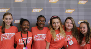 A group of high school girls wearing Design Matters! T-shirts.