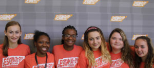 A group of six high school girls wearing Design Matters! Camp t-shirts.
