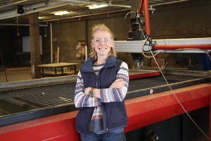 Michaela Stanfill with water jet cutter