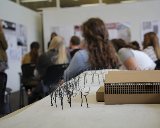 Model in foreground, final review in background