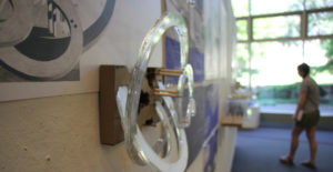 A project made of plexiglass rings mounted on the wall.