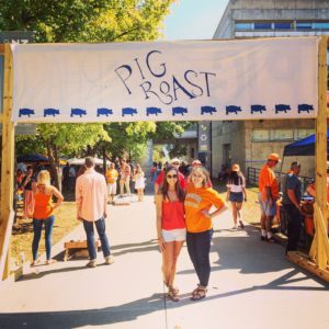 two students at pig roast