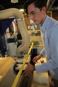 Student using machine in lab