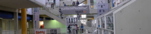 Banners for TAAST hang along the railings inside the Art + Architecture Building.