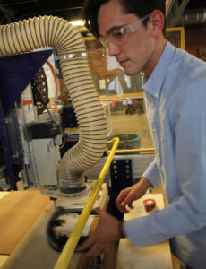Student using machine in lab