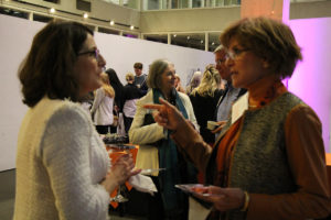 Faculty, Staff and Alumni chatting at Centennial Jubilee