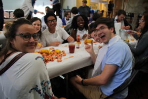 students eating and smiling at Brag + Boil 2018