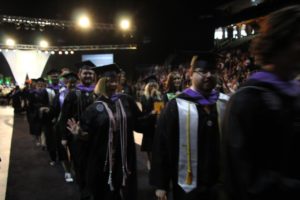 Students walking at Spring Commencement 2018