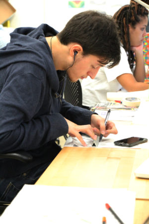 Male student drawing in studio