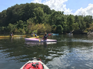 students in kayaks