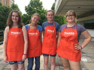 Four campers with Maker aprons