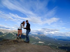 Ashlin Fox with fiance in Alaska-wide blue sky