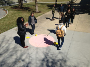 Students outside with DJ Trischler's design