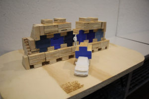a model of the plus pod micro house that shows it in a community style and in a truck for transportation