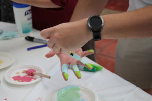 A student painting his hand