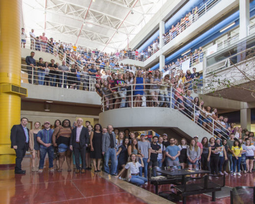 Group shot in atrium of students, faculty, staff