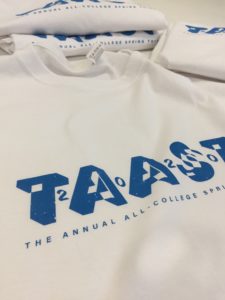 Close-up of TAAST 2020 t-shirt with blue logo on white shirt