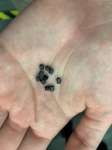 Local Motors pellets in palm of hand
