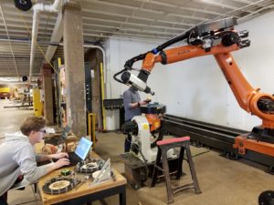 people working with large robot