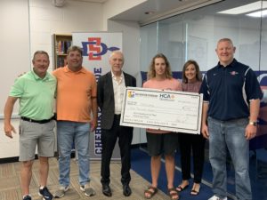 Family, others holding huge check