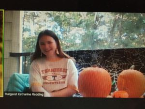 screenshot of student and pumpkins