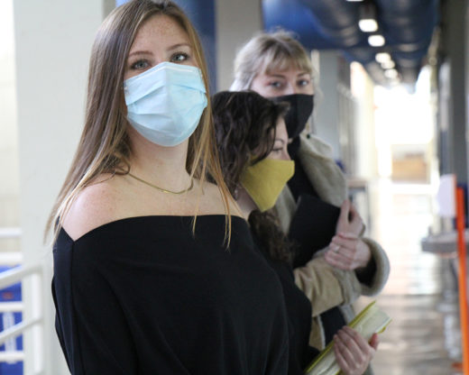 three students with masks