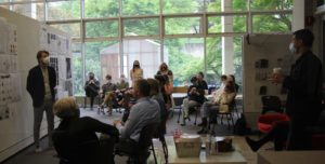 image of many students and faculty at Final Reviews