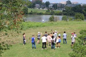 students in field at Cherokee Farm