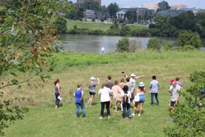 students in field at Cherokee Farm