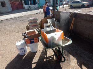 wheelbarrows of supplies