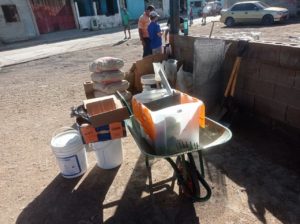 wheelbarrows of supplies