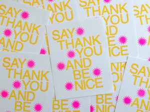 cards printed with "Say thank you and be nice"