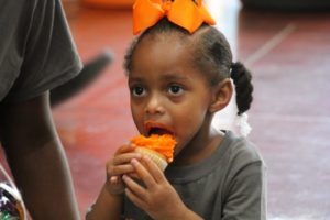 child eating cupcake graduation celebration 2022