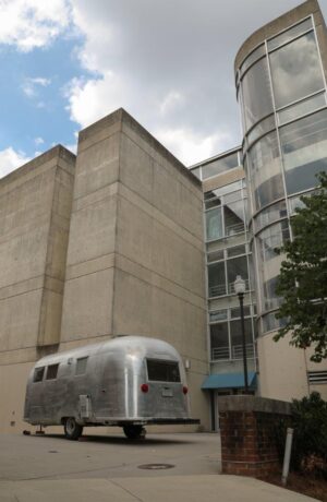 Airstream trailer with building in background