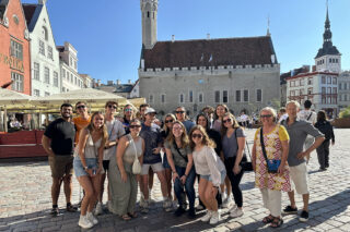 Beshoy Daniel and members of the Finland Architecture Institute cohort at Tallinn's Town Hall Square (Raekoja plats) in the Old Town of Tallinn, Estonia.