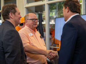 David Anderson shakes Jeff Gerber's hand during the Gerber Family Weekend Tailgate.