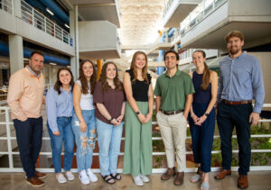 Johnson Architecture's Vice President and Principal Architect Joey Staats, left, and Project Manager Jeremiah Corbett (’18) with architecture and interior architecture students supported by JAI's scholarships in 2024-2025.