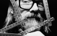 Artistic image of R. Michael Hendrix with rulers.