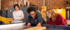 Felicia Francine Dean, Assistant Professor in the School of Interior Architecture, works with students on their project at the Fab Lab on October 31, 2023. Photo by Steven Bridges/University of Tennessee.