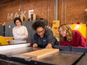 Felicia Francine Dean, Assistant Professor in the School of Interior Architecture, works with students on their project at the Fab Lab on October 31, 2023. Photo by Steven Bridges/University of Tennessee.