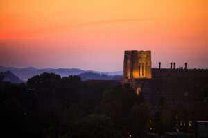 Ayres Hall at sunrise with the Smoky Mountains in the background on September 11, 2019. Photo by Steven Bridges/University of Tennessee