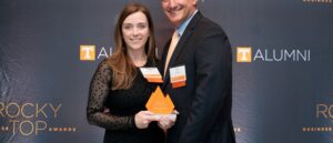 Kira McKeown-Adamo, left, and Robert Adamo, right, pose with their 2025 Rocky Top Business Award.
