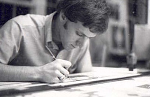 In black and white, Kem Hinton works at a drafting table in 1976.